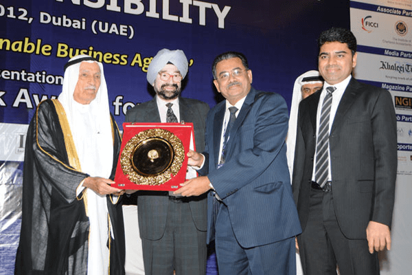 Golden Peacock Award for CSR being conferred upon Muthoot Finance Ltd. in the Financial Services sector at the 7th International Conference on SOCIAL RESPONSIBILITY at the Dubai Global Convention 2012.